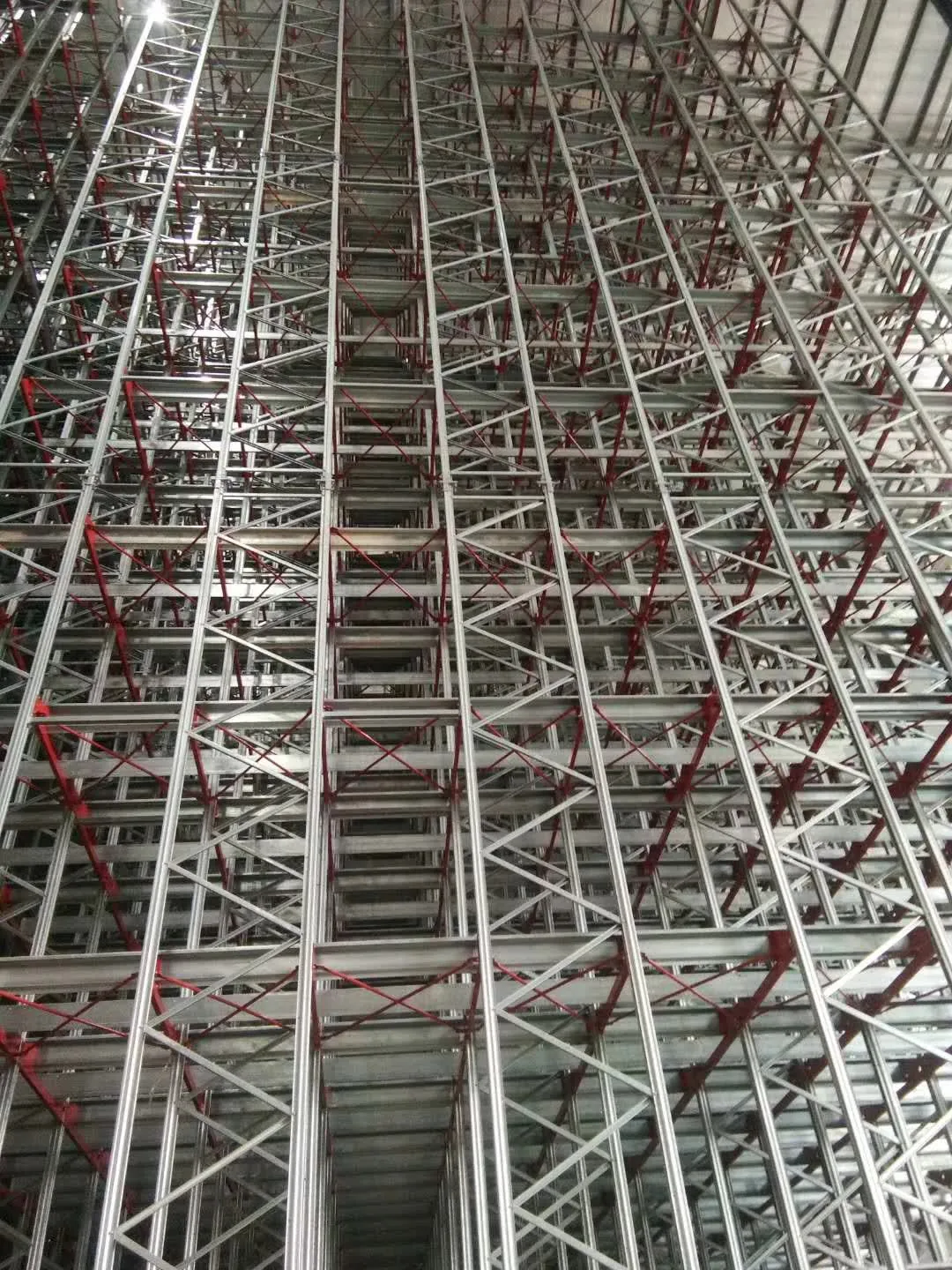 Galvanised high-bay racking structure rising to 26.7 metres in a Canadian food-industry AS/RS warehouse